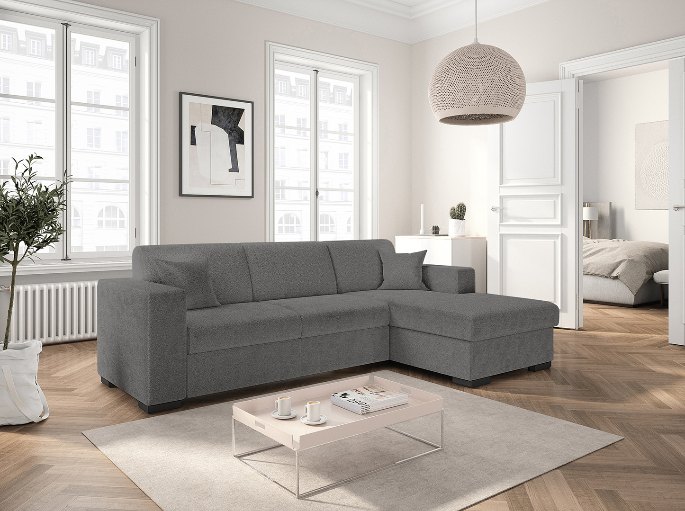 Séjour équipé d'une banquette convertible en tissu bouclé clair