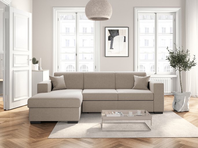 Banquette convertible dépliée en couchage dans un séjour lumineux