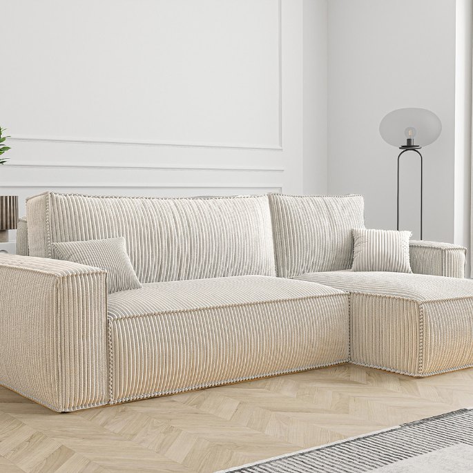 Vue de trois quarts d’une banquette dépliée dans une pièce claire