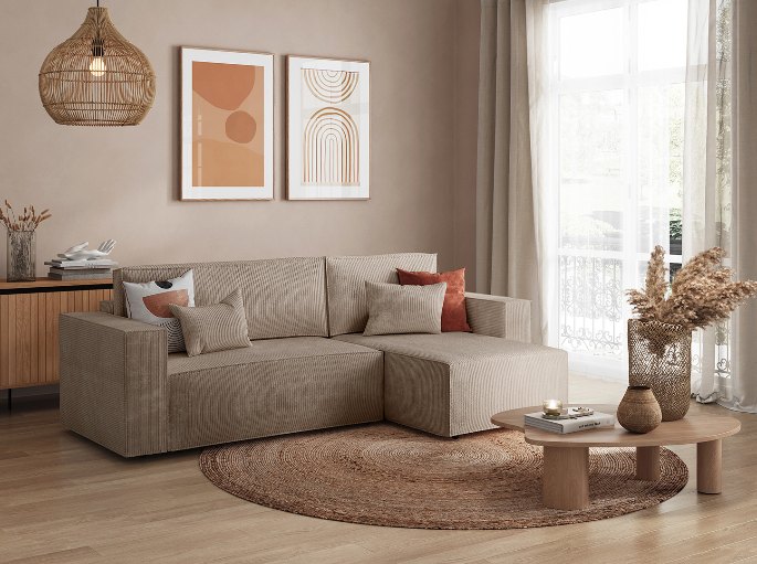 Couchage d'appoint replié en position assise dans un séjour clair