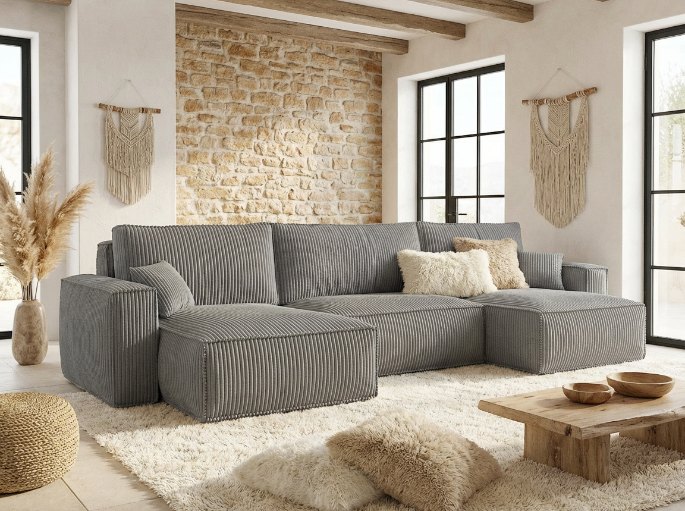 Couchage d'appoint déplié le long d'un mur de petit salon