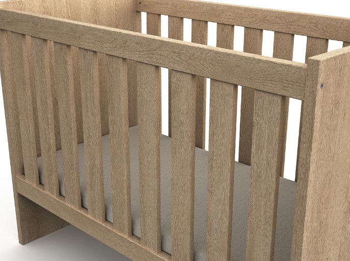 Détail des barreaux en bois naturel et du cadre d'un couchage pour bébé