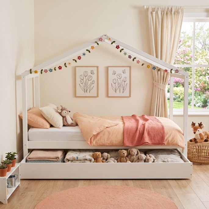 Couchage bas blanc avec tiroir de lit d'appoint pour recevoir un copain