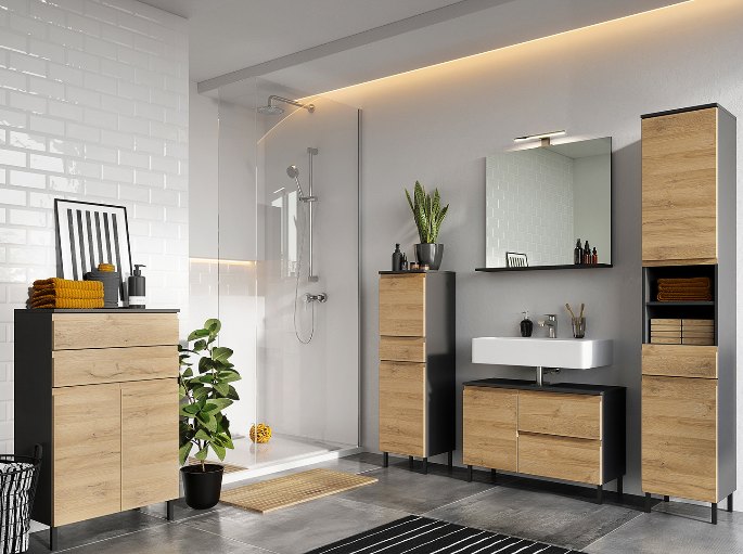 Plan de toilette bois et caisson graphite devant un mur carrelé blanc