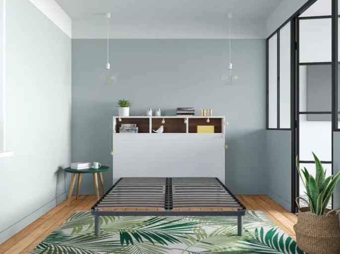 Base de lit anthracite installée devant une verrière intérieure, chambre lumineuse