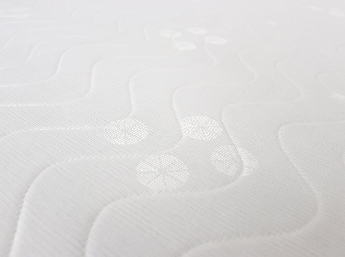 Tissu de recouvrement matelassé avec ses piqûres décoratives en surface