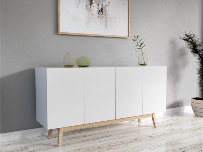 Buffet bas blanc sur pi&egrave;tement en bois clair dans une pi&egrave;ce lumineuse