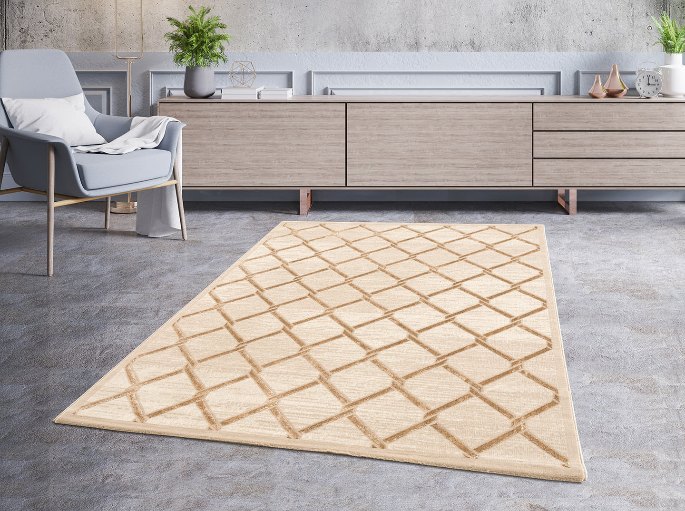 Espace détente avec fauteuil et meuble bas bordés par une surface au sol à relief