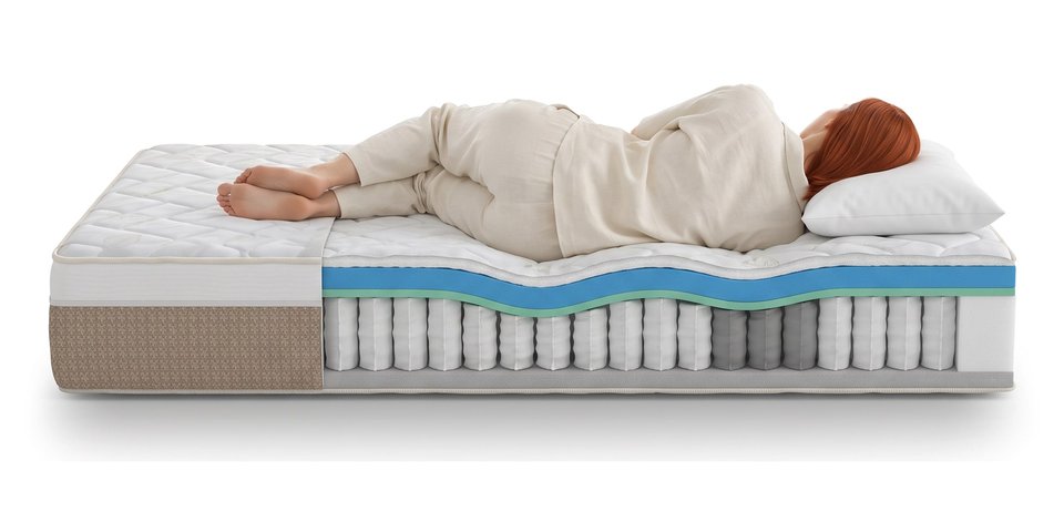 Coupe du matelas Rizière sous une dormeuse allongée sur le côté